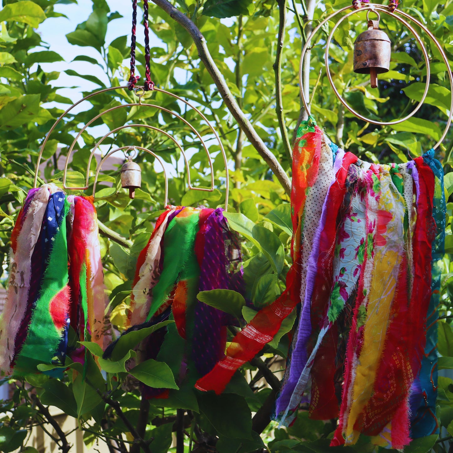 Surya Circle Chime with Rustic Bell, Handmade Metal Chime Assorted Cloth Tassels - Aksa Home Decor