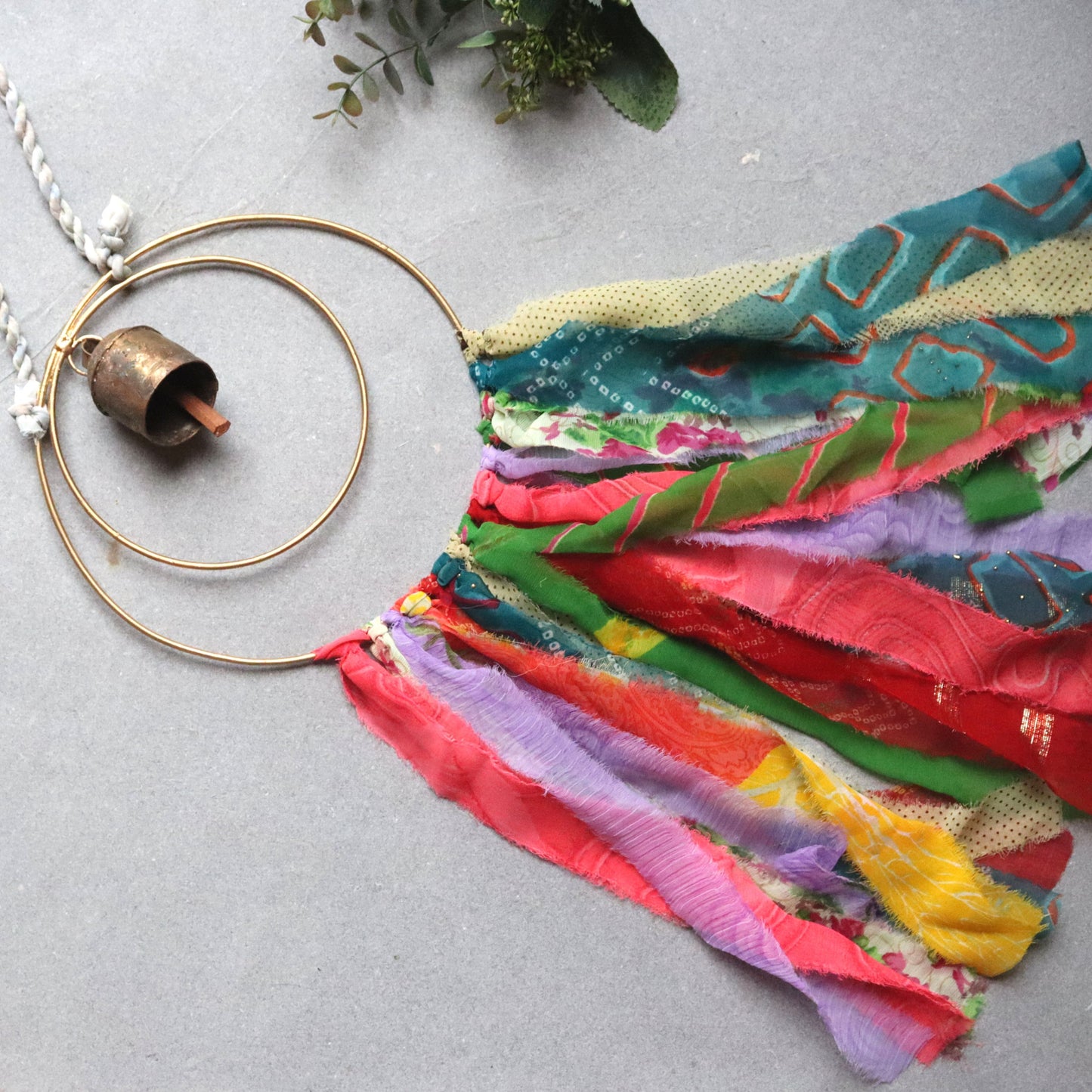 Surya Circle Chime with Rustic Bell - Metal, Assorted Cloth Tassels, Handmade, Twisted sari hanging loop - Aksa Home Decor
