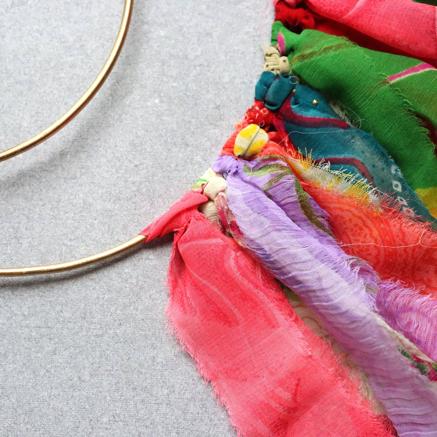 Surya Circle Chime with Rustic Bell - Metal, Assorted Cloth Tassels, Handmade, Twisted sari hanging loop - Aksa Home Decor