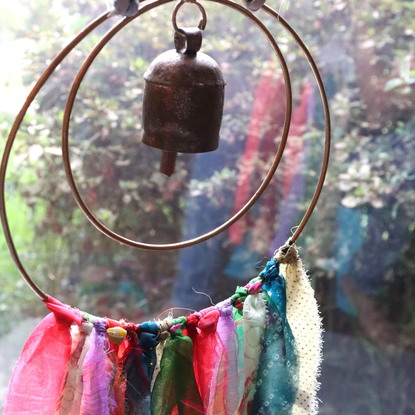 Surya Circle Chime with Rustic Bell - Metal, Assorted Cloth Tassels, Handmade, Twisted sari hanging loop - Aksa Home Decor