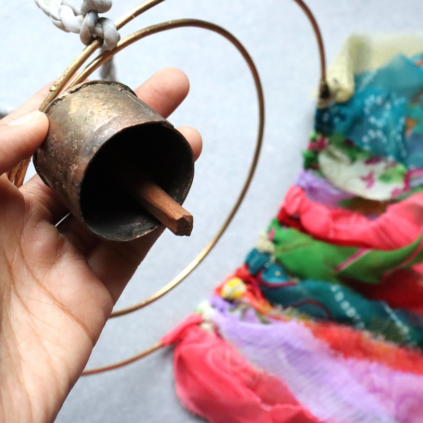 Surya Circle Chime with Rustic Bell - Metal, Assorted Cloth Tassels, Handmade, Twisted sari hanging loop - Aksa Home Decor 